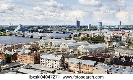 "Daugava River or Western Dvina, with the Railway Bridge, Dzelzce??a tilts, Latvian National Library and market halls, Riga Central Market, Riga, Latvia, Europe" View Large Photo Image Stock Image - "Daugava River or Western Dvina, with the Railway Bridge, Dzelzce??a tilts, Latvian National Library and market halls, Riga Central Market, Riga, Latvia, Europe". Fotosearch