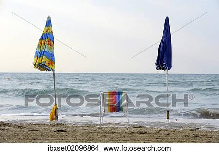 "Deck chair with parasols on the beach of the northern Adriatic Sea near Cavallino camping site, Jesolo, Venice, Italy, Europe" View Large Photo Image Picture - "Deck chair with parasols on the beach of the northern Adriatic Sea near Cavallino camping site, Jesolo, Venice, Italy, Europe". Fotosearch