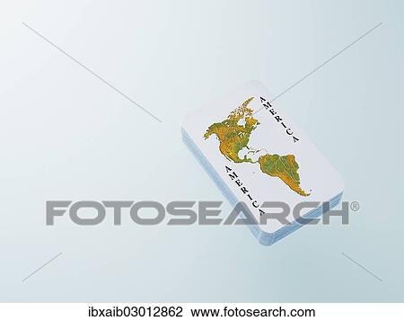 Stock Image - Deck of playing cards with a map of North America and South America. Fotosearch