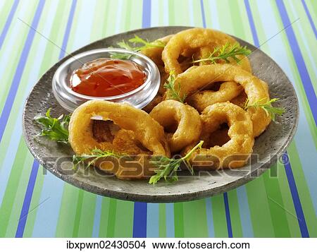 Deep fried breaded onion rings with chili sauce and salad View Large Photo Image Picture - Deep fried breaded onion rings with chili sauce and salad. Fotosearch