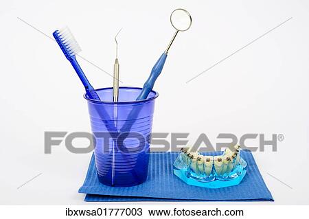 "Dental hygiene, toothbrush, dental mirror, dental instruments and teeth with fixed braces" View Large Photo Image Stock Image - "Dental hygiene, toothbrush, dental mirror, dental instruments and teeth with fixed braces". Fotosearch