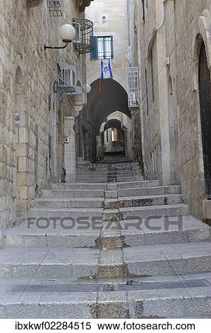 "Deserted alleyway with Israeli flag hanging from a window above an archway, Muslim Quarter, Old City, Jerusalem, Middle East" View Large Photo Image Stock Photography - "Deserted alleyway with Israeli flag hanging from a window above an archway, Muslim Quarter, Old City, Jerusalem, Middle East". Fotosearch