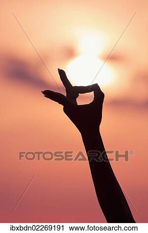 Detail of female hand forming Mudra gesture used in yoga practice meditation View Large Photo Image Stock Image - Detail of female hand forming Mudra gesture used in yoga practice meditation. Fotosearch
