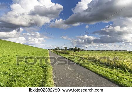 Stock Image - "Dike on the Elbe river, Drochtersen Ritsch, Kehdinger Land, Lower Saxony, Germany, Europe, Muhafazat al Mahrah, Germany, Europe". Fotosearch