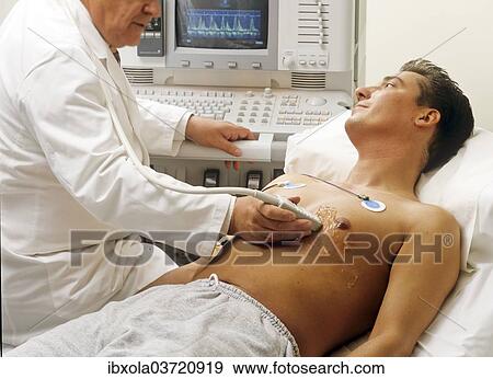 "Doctor and patient at a ECG, electrocardiographic examination, Germany, Europe" View Large Photo Image Stock Photo - "Doctor and patient at a ECG, electrocardiographic examination, Germany, Europe". Fotosearch