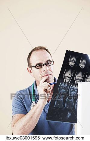 "Doctor looking at an X-ray, Mannheim, Baden-Wurttemberg, Germany, Europe" View Large Photo Image Stock Photography - "Doctor looking at an X-ray, Mannheim, Baden-Wurttemberg, Germany, Europe". Fotosearch