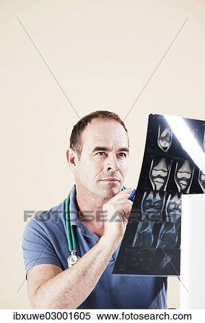 "Doctor looking at an X-ray, Mannheim, Baden-Wurttemberg, Germany, Europe" View Large Photo Image Stock Photography - "Doctor looking at an X-ray, Mannheim, Baden-Wurttemberg, Germany, Europe". Fotosearch