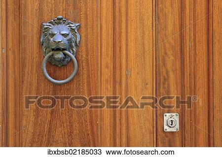 Stock Image - "Door knocker in the form of a lion's head on the front door of a house, Valletta, Malta, Europe". Fotosearch