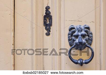 Stock Photo - "Door knocker in the form of a lion's head on the front door of a house, Valletta, Malta, Europe". Fotosearch