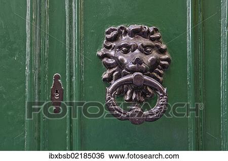 Stock Photograph - "Door knocker in the form of a lion's head on the front door of a house, Valletta, Malta, Europe". Fotosearch
