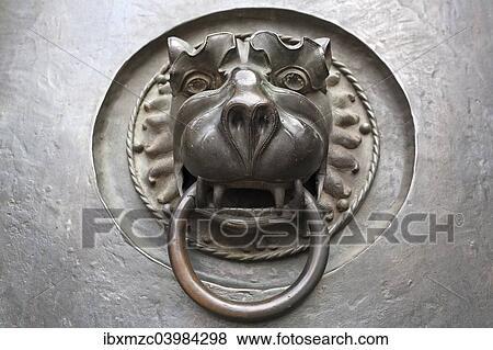 "Door knocker with a lion's head, 14th century, main entrance to St Lorenz Church, Nuremberg, Middle Franconia, Bavaria, Germany, Europe" View Large Photo Image Stock Photo - "Door knocker with a lion's head, 14th century, main entrance to St Lorenz Church, Nuremberg, Middle Franconia, Bavaria, Germany, Europe". Fotosearch