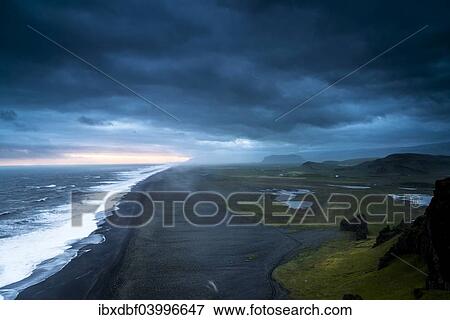 "Dramatic clouds, black sandy beach near Dyrholaey, south coast, Southern Region, Iceland, Europe" View Large Photo Image Stock Photo - "Dramatic clouds, black sandy beach near Dyrholaey, south coast, Southern Region, Iceland, Europe". Fotosearch