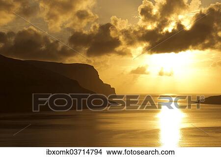 "Dramatic light mood, clouds, setting sun and the sea, Streymoy, Faroe Islands, Denmark, Europe" View Large Photo Image Picture - "Dramatic light mood, clouds, setting sun and the sea, Streymoy, Faroe Islands, Denmark, Europe". Fotosearch