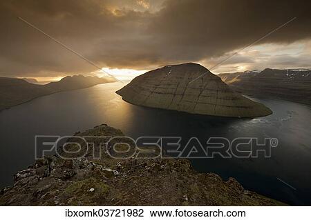 "Dramatic mood lighting over the islands of Kalsoy, Kunoy and Bordoy, Borooy, Norooyar, Faroe Islands, Denmark, Europe" View Large Photo Image Stock Image - "Dramatic mood lighting over the islands of Kalsoy, Kunoy and Bordoy, Borooy, Norooyar, Faroe Islands, Denmark, Europe". Fotosearch
