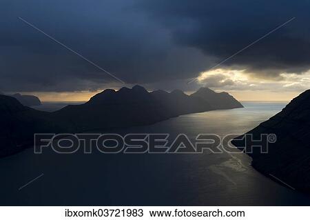 "Dramatic mood lighting over the islands of Kalsoy and Kunoy, Kalsoy, Norooyar, Faroe Islands, Denmark, Europe" View Large Photo Image Stock Image - "Dramatic mood lighting over the islands of Kalsoy and Kunoy, Kalsoy, Norooyar, Faroe Islands, Denmark, Europe". Fotosearch