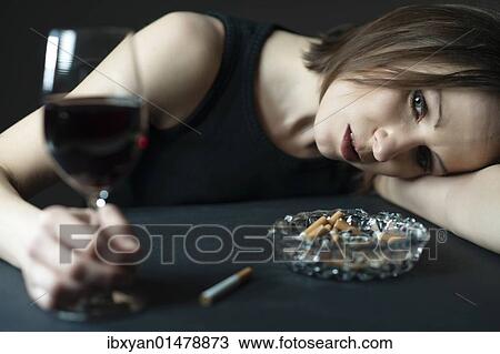 Stock Image - Drunk woman with wine. Fotosearch