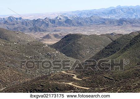"Dry valley with road in a Karoo landscape at Helskloof Pass, Richtersveld National Park, Namaqualand, Northern Cape Province, South Africa, Africa" View Large Photo Image Stock Photography - "Dry valley with road in a Karoo landscape at Helskloof Pass, Richtersveld National Park, Namaqualand, Northern Cape Province, South Africa, Africa". Fotosearch