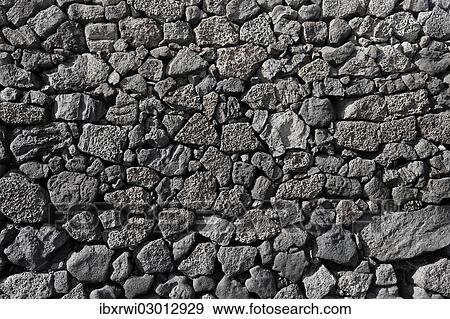 "Dry wall constructed from individually stacked lava rocks, typical feature of Lanzarote, Lanzarote, Canary Islands, Spain, Europe" View Large Photo Image Stock Photo - "Dry wall constructed from individually stacked lava rocks, typical feature of Lanzarote, Lanzarote, Canary Islands, Spain, Europe". Fotosearch