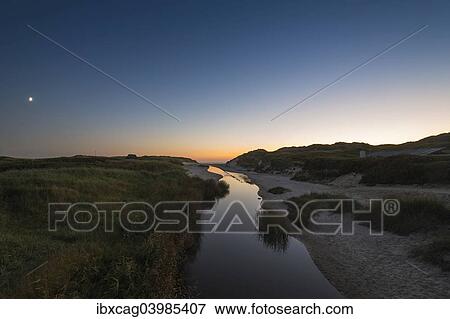 "Dune landscape with river Henne Molle A at sunset, Henne Strand, Region of Southern Denmark, Denmark, Europe" View Large Photo Image Stock Photo - "Dune landscape with river Henne Molle A at sunset, Henne Strand, Region of Southern Denmark, Denmark, Europe". Fotosearch