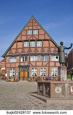 "Dyers' house with market fountain and monument to Hein Lueth, Luetjenburg, Schleswig-Holstein, Germany, Europe" View Large Photo Image Stock Photo - "Dyers' house with market fountain and monument to Hein Lueth, Luetjenburg, Schleswig-Holstein, Germany, Europe". Fotosearch