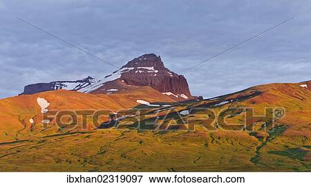"Dyrfjoell massif in the morning light, Bakkageroi, Iceland, Europe" View Large Photo Image Stock Photo - "Dyrfjoell massif in the morning light, Bakkageroi, Iceland, Europe". Fotosearch