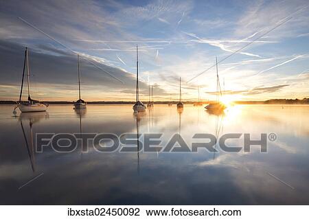 Stock Image - "Early morning, boats on Lake Starnberg near Tutzing, Bavaria, Germany, Europe, PublicGround, Europe". Fotosearch