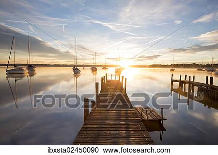 Stock Image - "Early morning, jetty at Lake Starnberg near Tutzing, Bavaria, Germany, Europe, PublicGround, Europe". Fotosearch