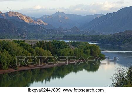 "Early morning mood with the smooth Orange River, also known as Gariep River, between South Africa and Namibia, near Sendelingsdrif, Richtersveld, South Africa, Africa" View Large Photo Image Stock Photo - "Early morning mood with the smooth Orange River, also known as Gariep River, between South Africa and Namibia, near Sendelingsdrif, Richtersveld, South Africa, Africa". Fotosearch