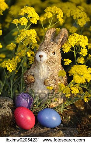 Easter bunny figure with brightly coloured Easter eggs View Large Photo Image Stock Image - Easter bunny figure with brightly coloured Easter eggs. Fotosearch