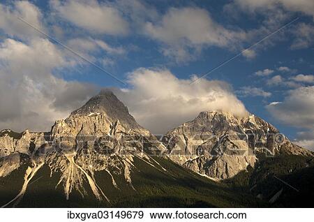 "Ehrwalder Sonnenspitze Mountain and Gruenstein Mountain in the evening light, Mieminger Chain, Ehrwald, Tyrol, Austria, Europe" View Large Photo Image Stock Photo - "Ehrwalder Sonnenspitze Mountain and Gruenstein Mountain in the evening light, Mieminger Chain, Ehrwald, Tyrol, Austria, Europe". Fotosearch