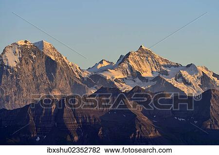 "Eiger North Face with Eiger, Monch and Jungfrau mountains in the morning light, Brienzer Rothorn Mountain, Brienz, Switzerland, Europe" View Large Photo Image Stock Image - "Eiger North Face with Eiger, Monch and Jungfrau mountains in the morning light, Brienzer Rothorn Mountain, Brienz, Switzerland, Europe". Fotosearch