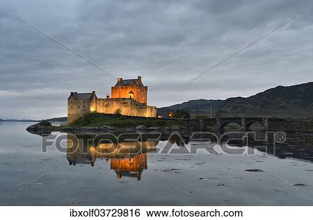 "Eilean Donan Castle, ancestral seat of the Scottish clan of Macrae, reflected in Loch Duich in the evening, Dornie, Highlands, Scotland, United Kingdom, Europe" View Large Photo Image Stock Photograph - "Eilean Donan Castle, ancestral seat of the Scottish clan of Macrae, reflected in Loch Duich in the evening, Dornie, Highlands, Scotland, United Kingdom, Europe". Fotosearch