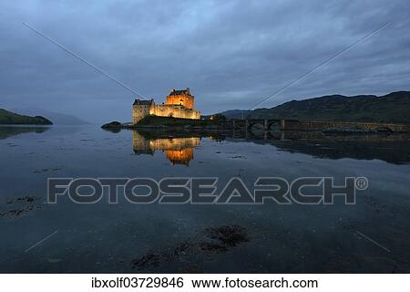 "Eilean Donan Castle, ancestral seat of the Scottish clan of Macrae, reflected in Loch Duich in the evening, Dornie, Highlands, Scotland, United Kingdom, Europe" View Large Photo Image Stock Photograph - "Eilean Donan Castle, ancestral seat of the Scottish clan of Macrae, reflected in Loch Duich in the evening, Dornie, Highlands, Scotland, United Kingdom, Europe". Fotosearch