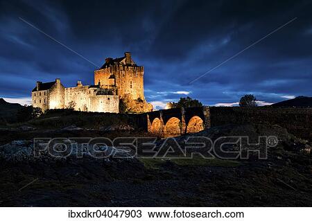 Stock Image - "Eilean Donan Castle at the confluence of Loch Duich, Loch Alsh and Loch Long, Scottish Highlands, Dornie, Scotland, United Kingdom, Europe". Fotosearch