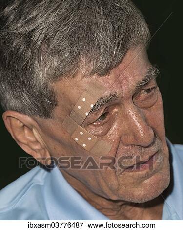 Elderly man with plasters on his face View Large Photo Image Stock Photo - Elderly man with plasters on his face. Fotosearch