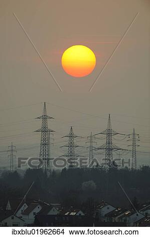 "Electric power transmission lines, electricity pylons, with the setting sun, Korb near Stuttgart, Baden-Wuerttemberg, Germany, Europe" View Large Photo Image Picture - "Electric power transmission lines, electricity pylons, with the setting sun, Korb near Stuttgart, Baden-Wuerttemberg, Germany, Europe". Fotosearch