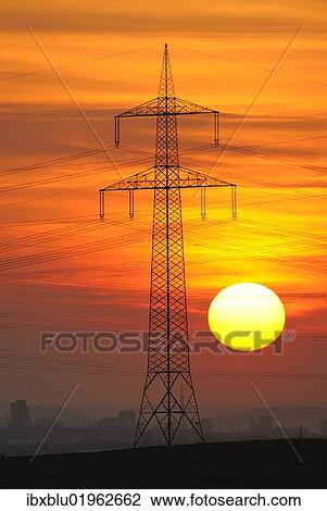 "Electric power transmission lines, electricity pylon, with the setting sun, Beinstein near Stuttgart, Baden-Wuerttemberg, Germany, Europe" View Large Photo Image Stock Image - "Electric power transmission lines, electricity pylon, with the setting sun, Beinstein near Stuttgart, Baden-Wuerttemberg, Germany, Europe". Fotosearch