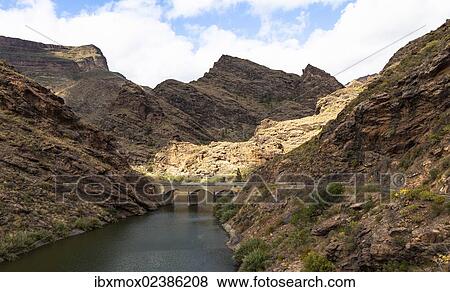 "Embalse Presa del Parralillo reservoir, also called """"the green lake"""", in the mountains of Caldera de Tejeda, also called a """"petrified storm"""", Artenara Region, Gran Canaria, Canary Islands, Spain, Europe, PublicGround, Europe" View Large Photo Image Stock Photo - "Embalse Presa del Parralillo reservoir, also called """"the green lake"""", in the mountains of Caldera de Tejeda, also called a """"petrified storm"""", Artenara Region, Gran Canaria, Canary Islands, Spain, Europe, PublicGround, Europe". Fotosearch