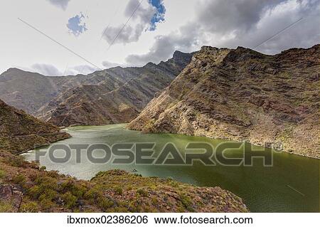 "Embalse Presa del Parralillo reservoir, also called """"the green lake"""", in the mountains of Caldera de Tejeda, also called a """"petrified storm"""", Artenara Region, Gran Canaria, Canary Islands, Spain, Europe, PublicGround, Europe" View Large Photo Image Stock Photograph - "Embalse Presa del Parralillo reservoir, also called """"the green lake"""", in the mountains of Caldera de Tejeda, also called a """"petrified storm"""", Artenara Region, Gran Canaria, Canary Islands, Spain, Europe, PublicGround, Europe". Fotosearch