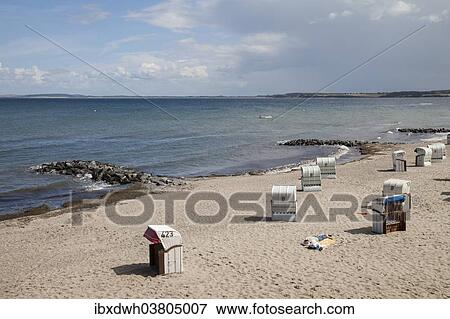 Stock Photo - "Empty beach chairs on the Baltic coast, Hohwacht, Schleswig-Holstein, Germany, Europe". Fotosearch