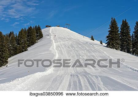 "Empty ski slope under a blue sky, Rellerli Hugeli skiing region in the Saanenland area, Schonried, Canton of Bern, Switzerland, Europe" View Large Photo Image Stock Photograph - "Empty ski slope under a blue sky, Rellerli Hugeli skiing region in the Saanenland area, Schonried, Canton of Bern, Switzerland, Europe". Fotosearch