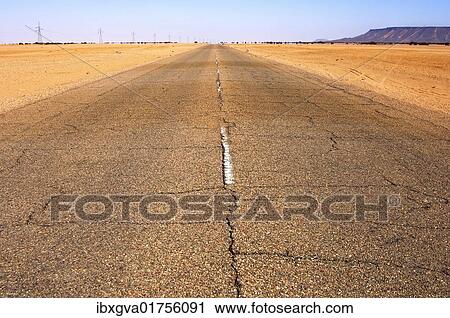 "Endless asphalt road running dead straight through the desert area near Al Awaynat, Libya, North Africa, Africa" View Large Photo Image Stock Image - "Endless asphalt road running dead straight through the desert area near Al Awaynat, Libya, North Africa, Africa". Fotosearch