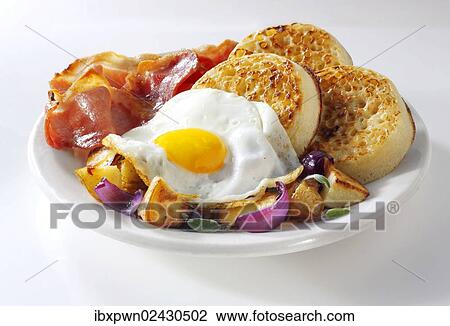 "English breakfast with fried potatoes, bacon, fried egg and crumpets" View Large Photo Image Stock Image - "English breakfast with fried potatoes, bacon, fried egg and crumpets". Fotosearch