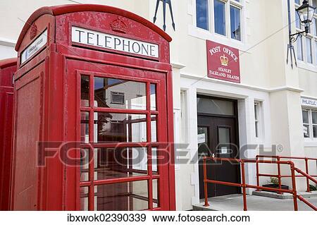"English phone booth in front of the post office in Port Stanley, capital of the Falkland Islands, East Falkland, Malvinas Islands, British Overseas Territory, South America" View Large Photo Image Stock Photo - "English phone booth in front of the post office in Port Stanley, capital of the Falkland Islands, East Falkland, Malvinas Islands, British Overseas Territory, South America". Fotosearch