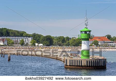 "Entrance to the port with lighthouse and beach, Travemunde, Lubeck, Schleswig-Holstein, Germany, Europe" View Large Photo Image Stock Image - "Entrance to the port with lighthouse and beach, Travemunde, Lubeck, Schleswig-Holstein, Germany, Europe". Fotosearch