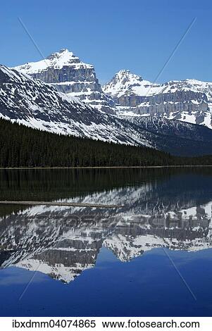 Stock Photography - "Epaulette Mountain and Kaufmann Peaks, right, reflected in Waterfowl Lake, Banff National Park, Rocky Mountains, Alberta Province, Canada, North America". Fotosearch