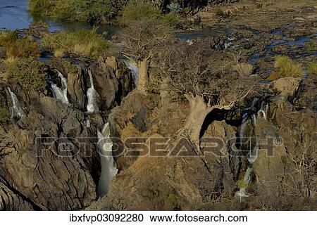"Epupa Falls, waterfalls of the Kunene River on the Namibian-Angolan border, Kunene Region, Namibia, Africa" View Large Photo Image Stock Image - "Epupa Falls, waterfalls of the Kunene River on the Namibian-Angolan border, Kunene Region, Namibia, Africa". Fotosearch