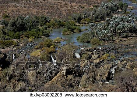 "Epupa Falls, waterfalls of the Kunene River on the Namibian-Angolan border, Kunene Region, Namibia, Africa" View Large Photo Image Stock Photo - "Epupa Falls, waterfalls of the Kunene River on the Namibian-Angolan border, Kunene Region, Namibia, Africa". Fotosearch