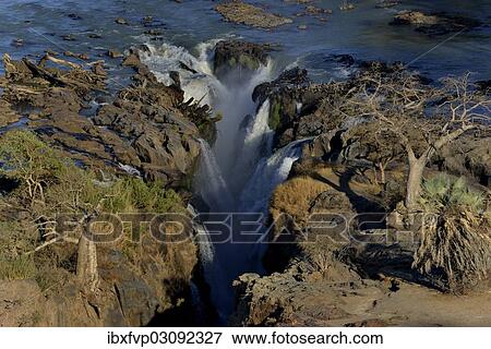 "Epupa Falls, waterfalls of the Kunene River on the Namibian-Angolan border, Kunene Region, Namibia, Africa" View Large Photo Image Stock Photo - "Epupa Falls, waterfalls of the Kunene River on the Namibian-Angolan border, Kunene Region, Namibia, Africa". Fotosearch