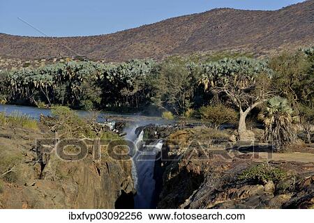 Stock Photograph - "Epupa Falls, waterfalls of the Kunene River on the Namibian-Angolan border, Kunene Region, Namibia, Africa". Fotosearch